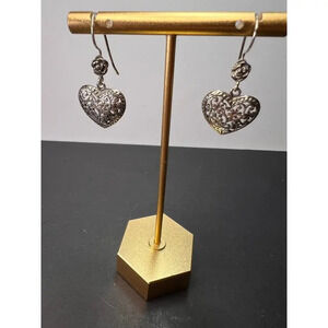 Sterling silver heart shaped earrings with floral design